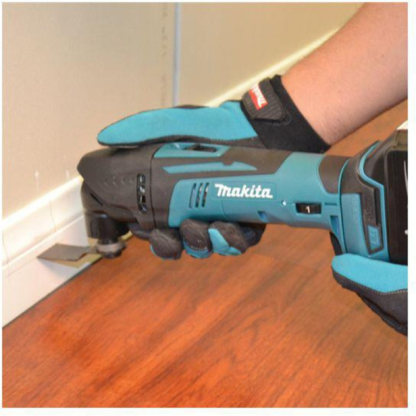 Многофункциональный инструмент Makita DTM50Z синий